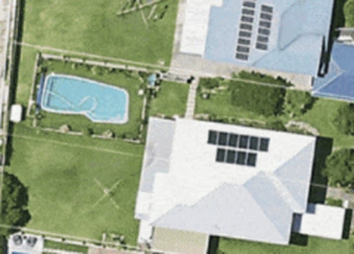 Latest aerial imagery of the property, a house with solar panels
